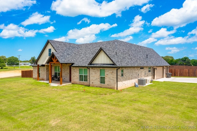 12349 County Road 3571, Ada, OK 74820 - view of property exterior with driveway, an attached garage, brick siding, a shingled roof, and board and batten siding
