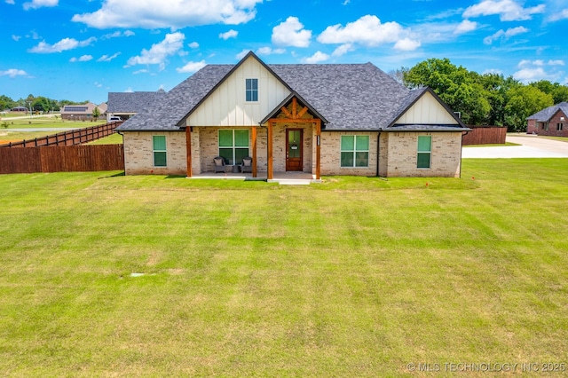 12349 County Road 3571, Ada, OK 74820 - view of front of property with brick siding, board and batten siding, and roof with shingles