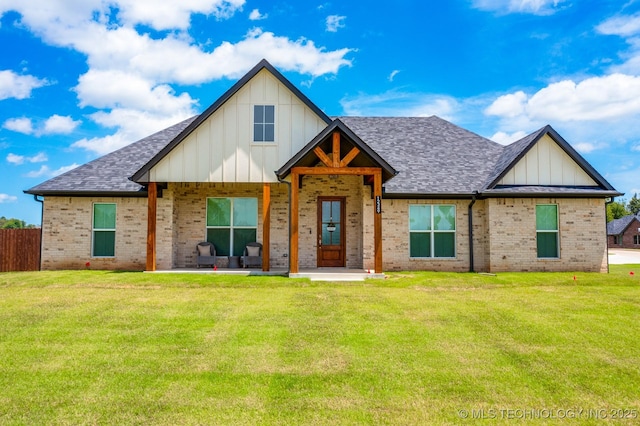 12349 County Road 3571, Ada, OK 74820 - view of front of house featuring board and batten siding, brick siding, and roof with shingles