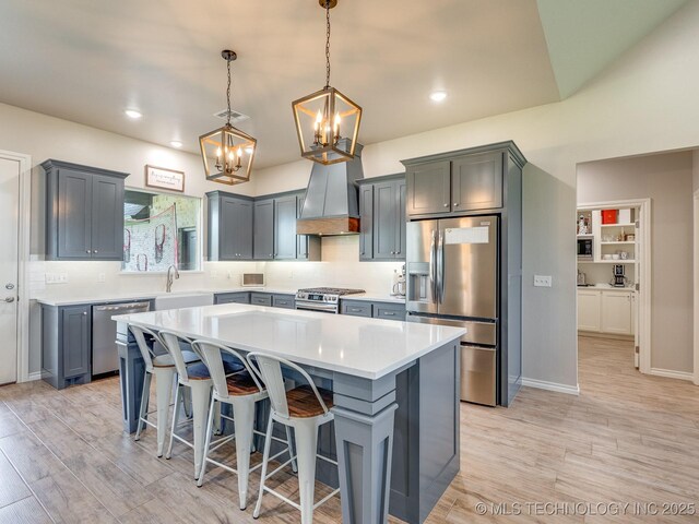 12349 County Road 3571, Ada, OK 74820 - kitchen featuring appliances with stainless steel finishes, a chandelier, light wood-style floors, light countertops, and recessed lighting