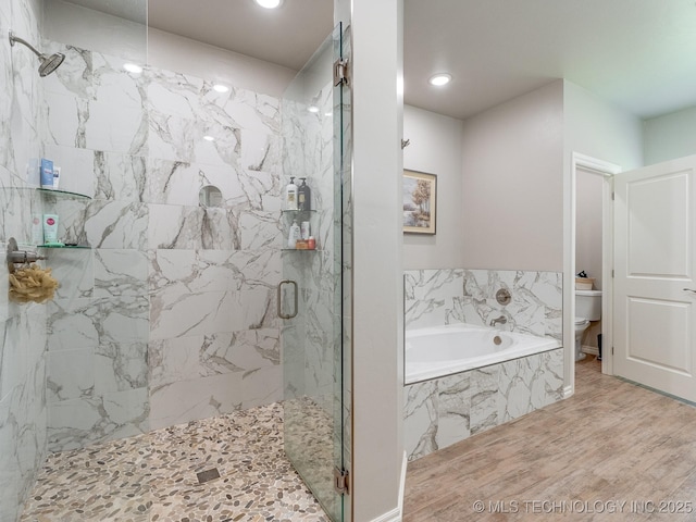 12349 County Road 3571, Ada, OK 74820 - bathroom with a garden tub, a marble finish shower, wood finished floors, and recessed lighting