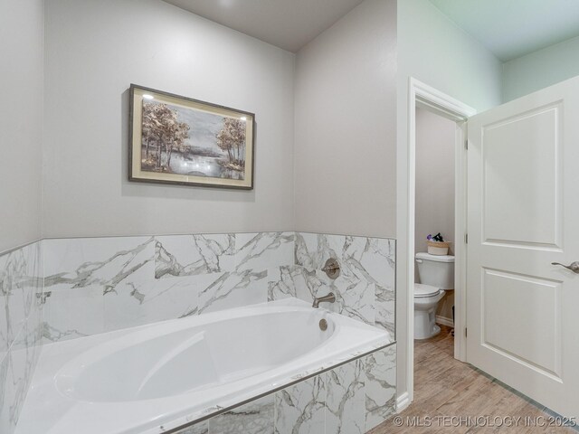 12349 County Road 3571, Ada, OK 74820 - full bathroom with a bath and wood finished floors