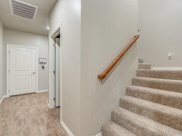12349 County Road 3571, Ada, OK 74820 - stairs featuring wood finished floors and baseboards