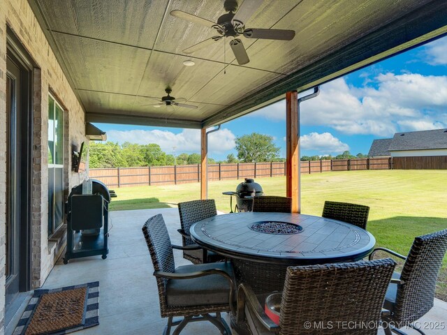 12349 County Road 3571, Ada, OK 74820 - fenced backyard with a ceiling fan, a patio area, and outdoor dining area