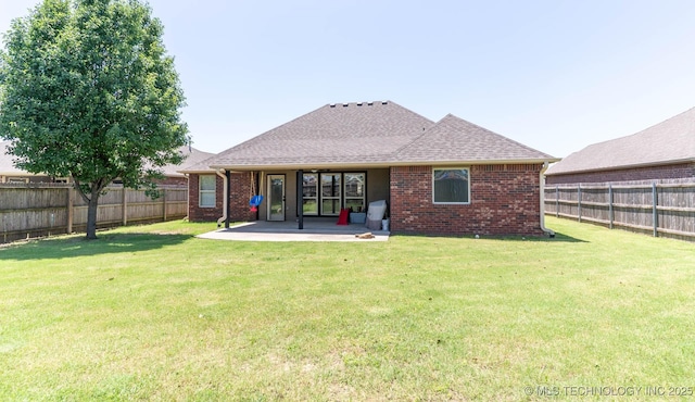 12901 N 124th E Pl, Collinsville, OK 74021 - back of property with brick siding, a patio, a fenced backyard, and roof with shingles