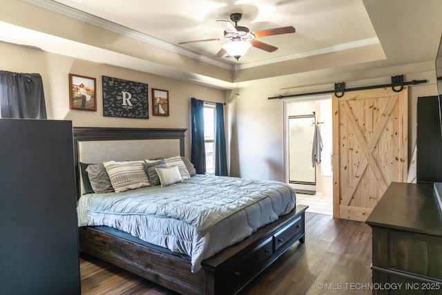 12901 N 124th E Pl, Collinsville, OK 74021 - bedroom featuring a raised ceiling, a barn door, wood finished floors, crown molding, and ensuite bath