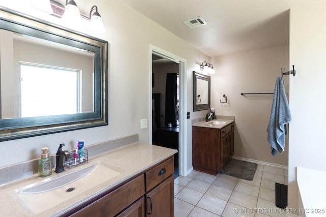 12901 N 124th E Pl, Collinsville, OK 74021 - full bathroom featuring two vanities and tile patterned flooring