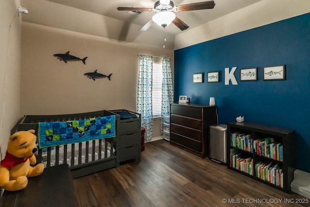12901 N 124th E Pl, Collinsville, OK 74021 - bedroom with dark wood-style floors, a ceiling fan, and vaulted ceiling