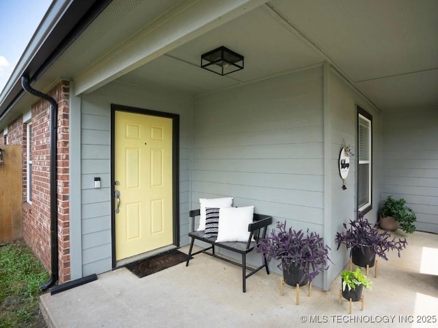 11001 N 146th E Ave, Owasso, OK 74055 - doorway to property featuring covered porch