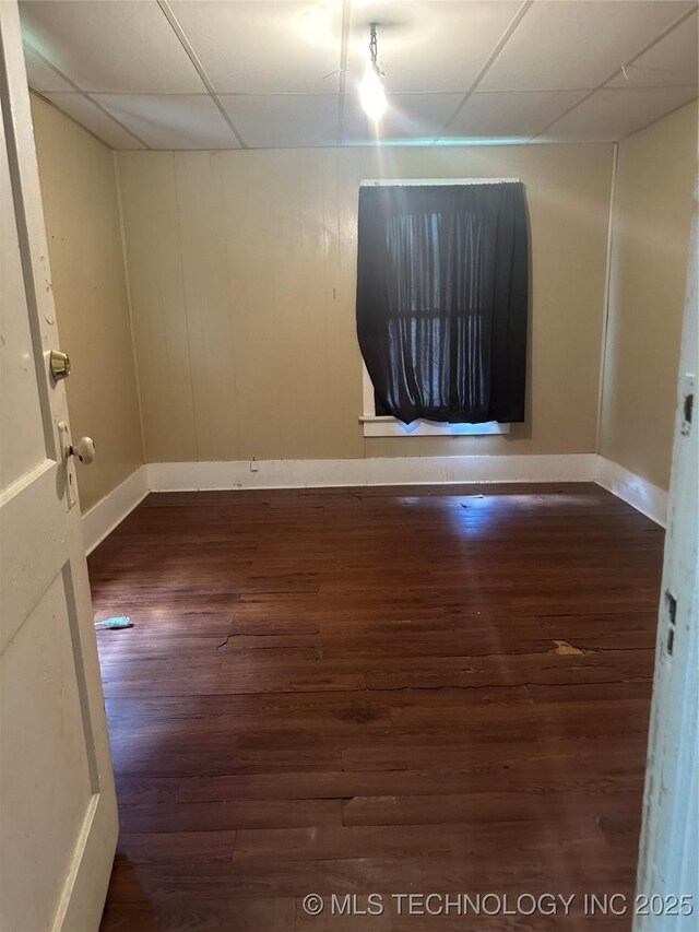 512 W Franklin, Haskell, OK 74436 - empty room featuring a paneled ceiling and wood finished floors