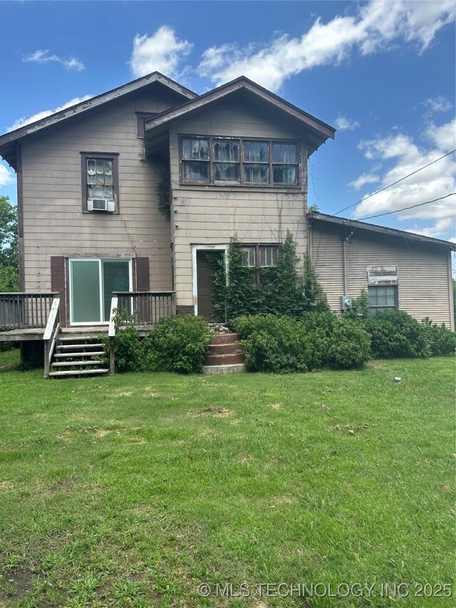 512 W Franklin, Haskell, OK 74436 - rear view of property with a deck, a yard, and cooling unit
