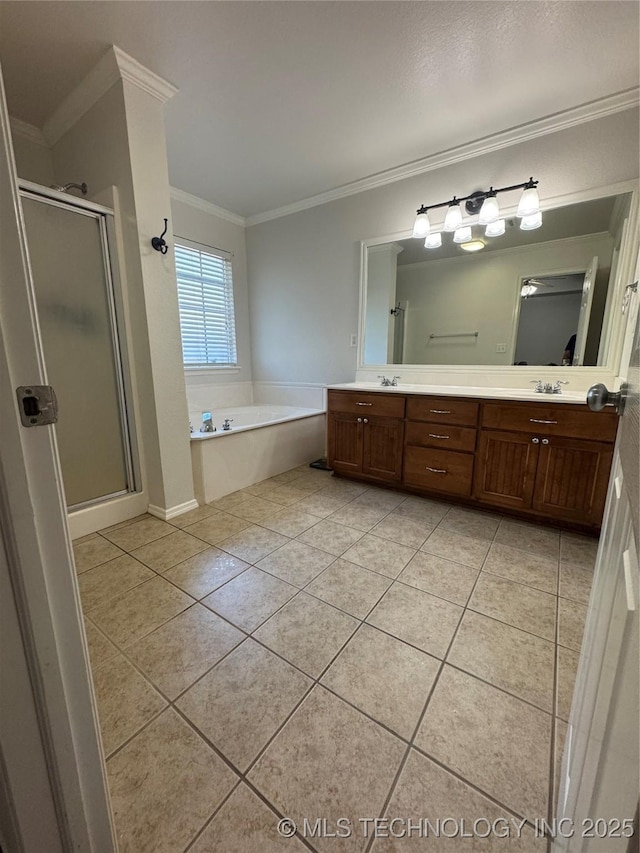 11725 S Vine Pl S, Jenks, OK 74037 - full bathroom with ornamental molding, tile patterned floors, a shower stall, a garden tub, and double vanity