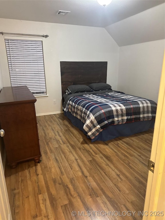 11725 S Vine Pl S, Jenks, OK 74037 - bedroom featuring wood finished floors and vaulted ceiling