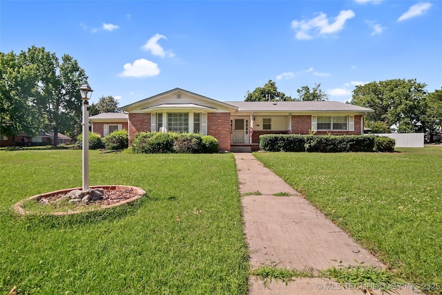 5153 S Marion Ave, Tulsa, OK 74135 - ranch-style home featuring brick siding and a front yard