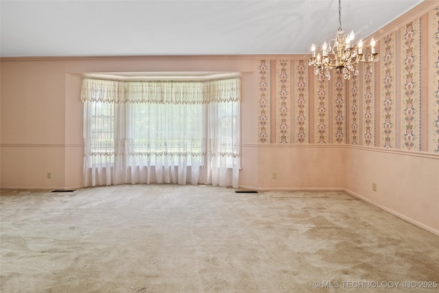 5153 S Marion Ave, Tulsa, OK 74135 - carpeted empty room with a chandelier, crown molding, and wallpapered walls