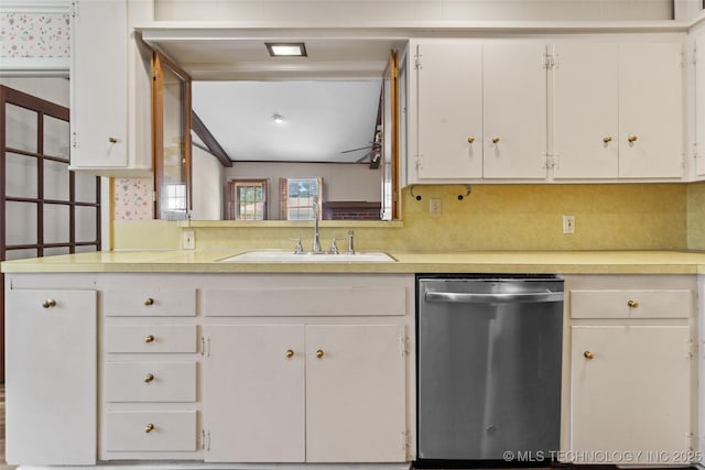 5153 S Marion Ave, Tulsa, OK 74135 - kitchen with stainless steel dishwasher, light countertops, and white cabinets