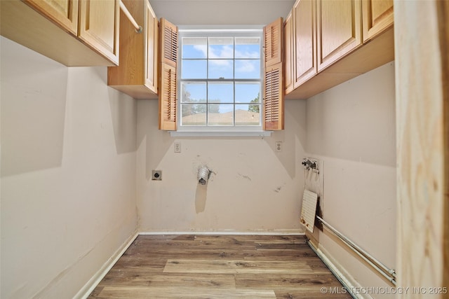 5153 S Marion Ave, Tulsa, OK 74135 - washroom with hookup for an electric dryer, cabinet space, light wood-style flooring, and heating unit