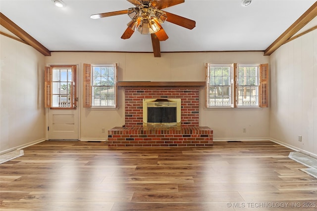 5153 S Marion Ave, Tulsa, OK 74135 - unfurnished living room featuring wood finished floors, ceiling fan, a fireplace, vaulted ceiling, and crown molding