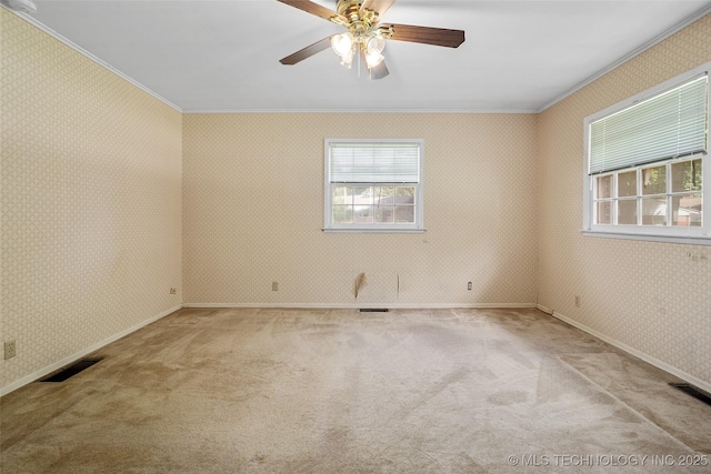 5153 S Marion Ave, Tulsa, OK 74135 - spare room featuring ornamental molding, wallpapered walls, carpet, and a ceiling fan