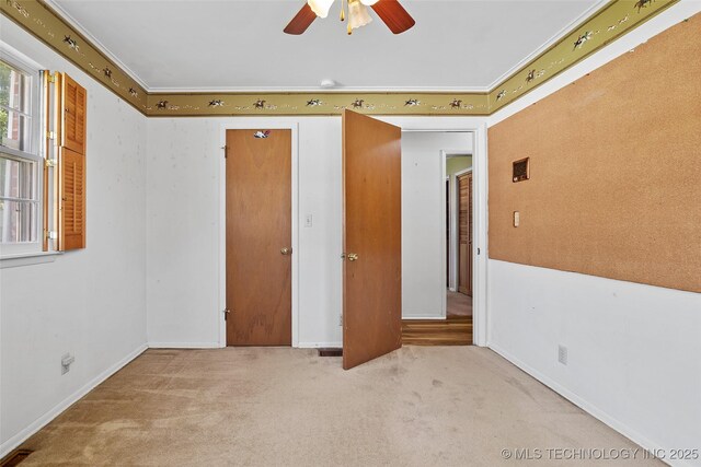5153 S Marion Ave, Tulsa, OK 74135 - unfurnished bedroom featuring carpet flooring and a ceiling fan
