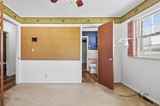 5153 S Marion Ave, Tulsa, OK 74135 - empty room featuring carpet, a ceiling fan, and healthy amount of natural light