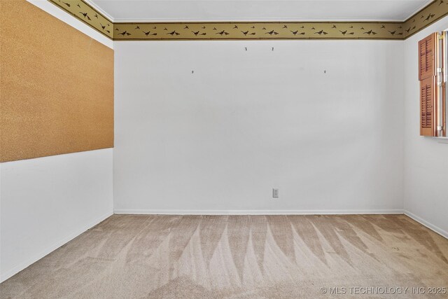 5153 S Marion Ave, Tulsa, OK 74135 - carpeted empty room with baseboards