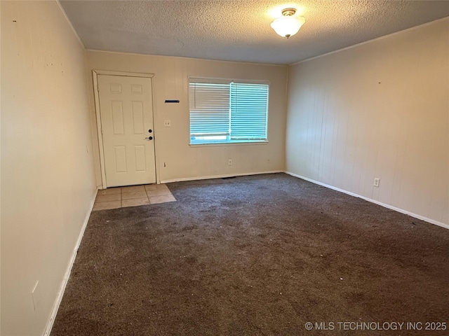 3024 S Ash Ct, Broken Arrow, OK 74012 - carpeted empty room with a textured ceiling