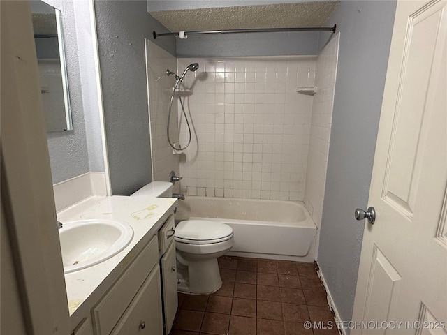 3024 S Ash Ct, Broken Arrow, OK 74012 - bathroom featuring vanity, tub / shower combination, tile patterned flooring, and a textured wall