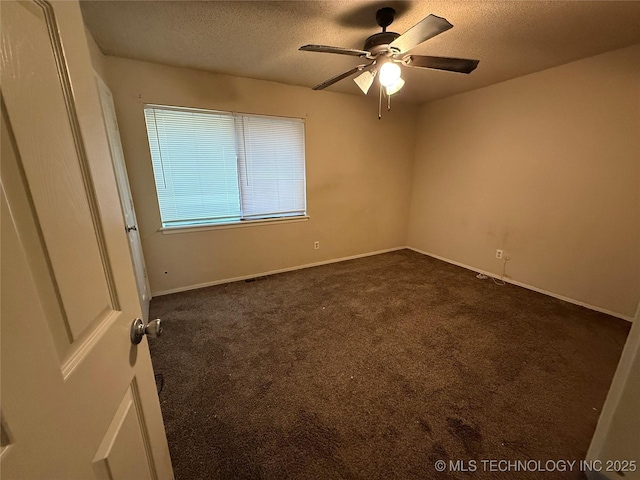 3024 S Ash Ct, Broken Arrow, OK 74012 - empty room with dark carpet, a textured ceiling, and a ceiling fan