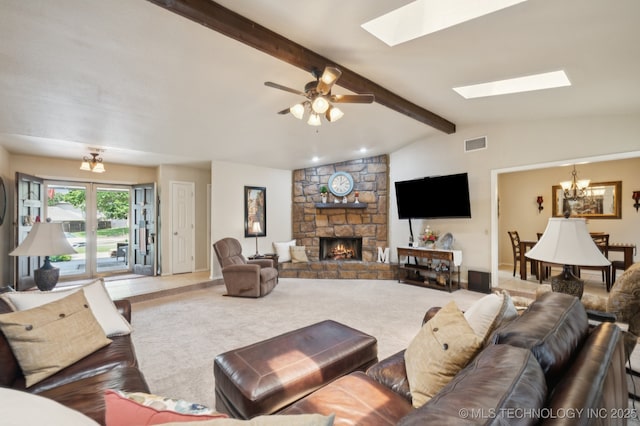 2807 W Atlanta Pl, Broken Arrow, OK 74012 - living room with a skylight, a chandelier, carpet flooring, and a stone fireplace