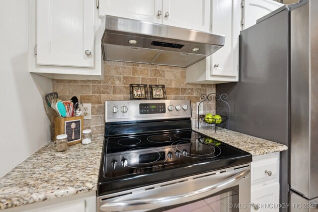 2807 W Atlanta Pl, Broken Arrow, OK 74012 - kitchen featuring stainless steel appliances, under cabinet range hood, white cabinetry, and backsplash