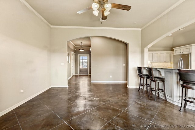 1854 E 137th Pl, Glenpool, OK 74033 - dining room with arched walkways, ceiling fan, and crown molding