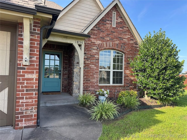 1854 E 137th Pl, Glenpool, OK 74033 - entrance to property featuring brick siding and a shingled roof