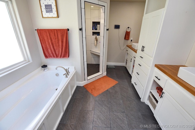 24042 S Black Valley Rd, Tahlequah, OK 74464 - full bathroom with vanity, a garden tub, and a stall shower