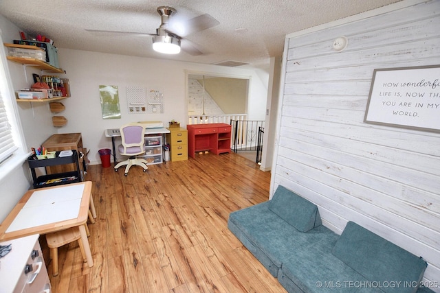 24042 S Black Valley Rd, Tahlequah, OK 74464 - office with ceiling fan, hardwood / wood-style floors, and a textured ceiling