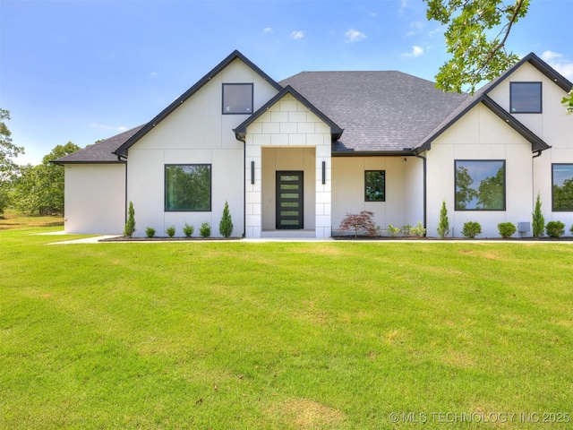 11446 Mary Knox Dr, Beggs, OK 74421 - view of front of home featuring roof with shingles, a front lawn, and stucco siding