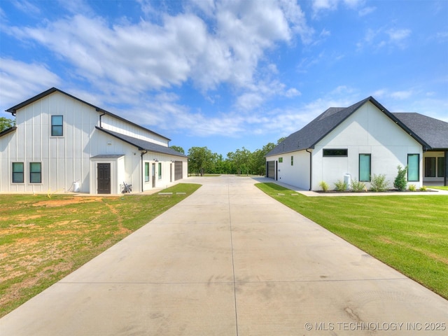 11446 Mary Knox Dr, Beggs, OK 74421 - view of side of property featuring a lawn and board and batten siding
