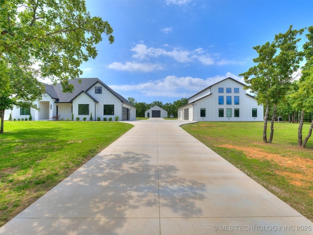 11446 Mary Knox Dr, Beggs, OK 74421 - view of front of home with a front lawn, driveway, an outdoor structure, and a garage