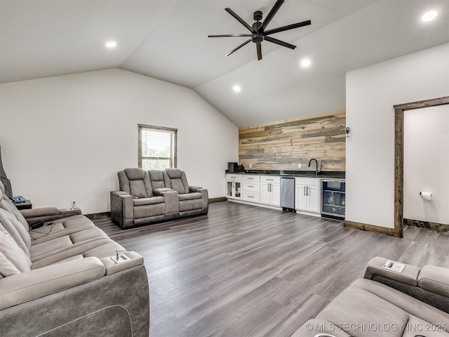 11446 Mary Knox Dr, Beggs, OK 74421 - living area featuring wine cooler, wet bar, recessed lighting, ceiling fan, and wooden walls