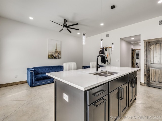 11446 Mary Knox Dr, Beggs, OK 74421 - kitchen featuring finished concrete floors, open floor plan, a kitchen island with sink, light countertops, and recessed lighting
