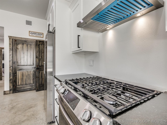 11446 Mary Knox Dr, Beggs, OK 74421 - kitchen with wall chimney exhaust hood, stainless steel appliances, and white cabinets