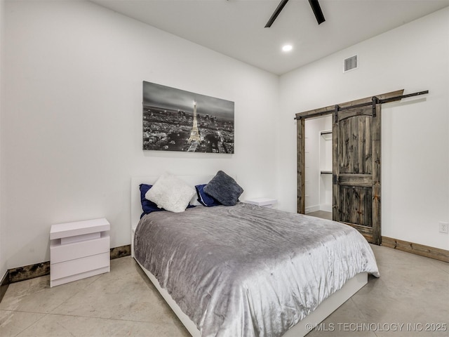 11446 Mary Knox Dr, Beggs, OK 74421 - bedroom with finished concrete floors, a barn door, recessed lighting, and a ceiling fan