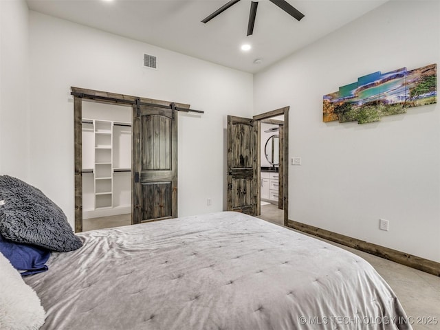 11446 Mary Knox Dr, Beggs, OK 74421 - bedroom featuring a barn door, recessed lighting, ceiling fan, and a spacious closet