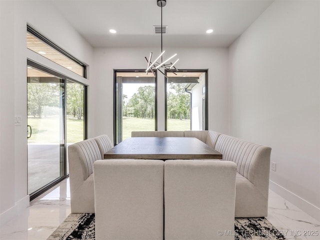 11446 Mary Knox Dr, Beggs, OK 74421 - dining area featuring light marble finish floors, a chandelier, healthy amount of natural light, and recessed lighting