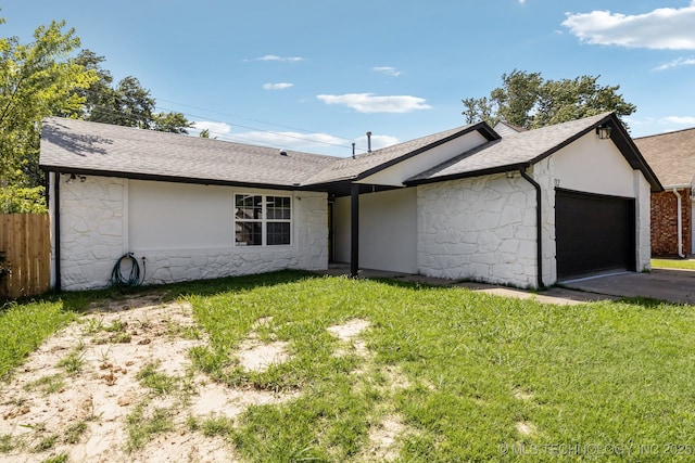 2712 S Fir Ave, Broken Arrow, OK 74012 - ranch-style house with stone siding, an attached garage, a shingled roof, and asphalt driveway