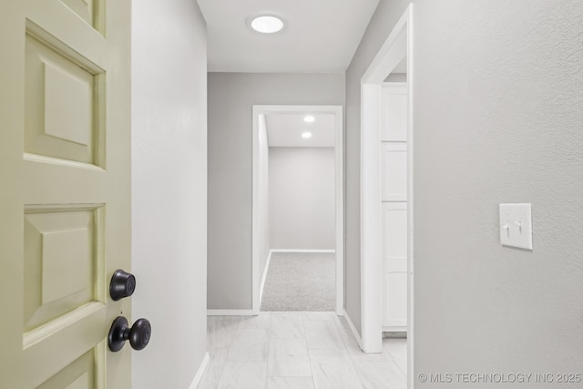 2712 S Fir Ave, Broken Arrow, OK 74012 - hall featuring light marble finish floors and baseboards