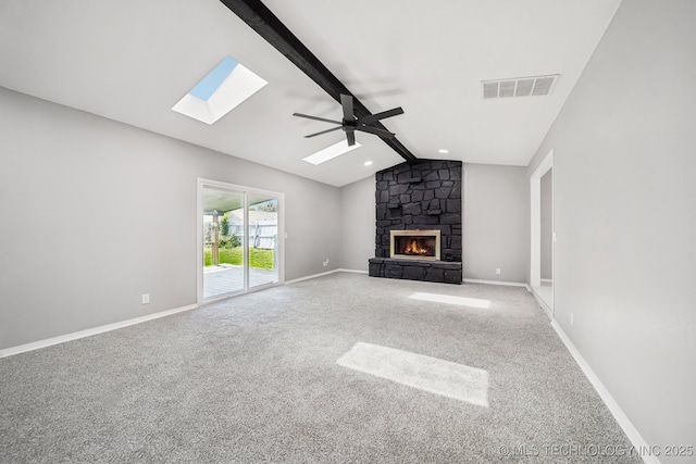 2712 S Fir Ave, Broken Arrow, OK 74012 - unfurnished living room featuring a skylight, a fireplace, carpet flooring, ceiling fan, and recessed lighting