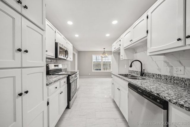 2712 S Fir Ave, Broken Arrow, OK 74012 - kitchen with appliances with stainless steel finishes, a chandelier, recessed lighting, light stone counters, and white cabinets