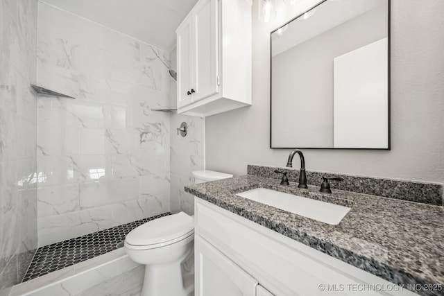 2712 S Fir Ave, Broken Arrow, OK 74012 - bathroom featuring vanity and a marble finish shower
