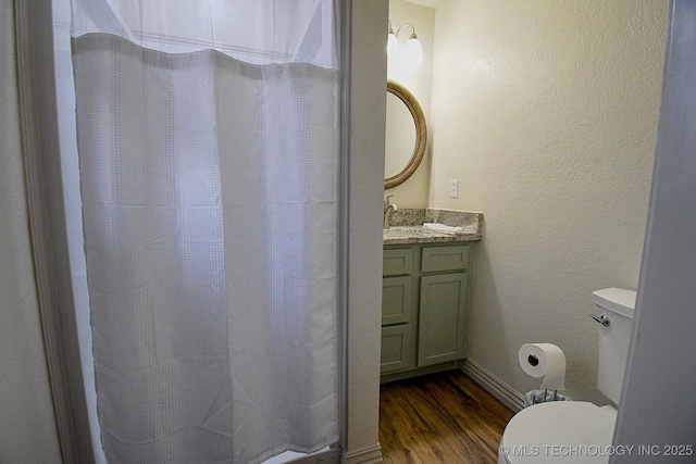 96539 S 4550th Rd, Vian, OK 74962 - full bathroom with wood finished floors, vanity, curtained shower, and a textured wall